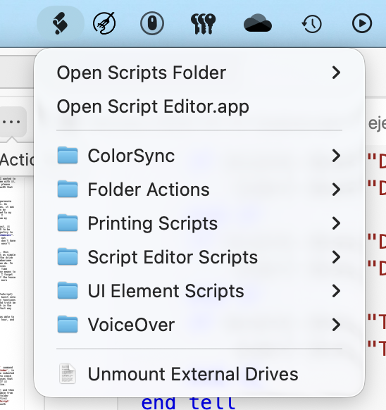 A screenshot of the macOS menu bar, showing the script menu on the far left. It looks like a paper scroll shown from a 3/4 angle, curled up to form an "S" shape. The are two main menu items: Open Scripts Folder (with right pointing arrow on the edge of the menu item), and Open Script Editor.app. There is a divider that spans the width of the menu, and below that are 6 folders all with right-pointing arrows: ColourSync, Folder Actions, Printing Scripts, Script Editor Scripts, UI Element Scripts, and VoiceOver. There is another full-width divider, the, at the very bottom of the menu, is my script called "Unmount External Drives". It has the icon of a simple text document - that is, a page with the top right corner folded inward such that it covers the page slightly, and fuzzy lines indicating text on the page.